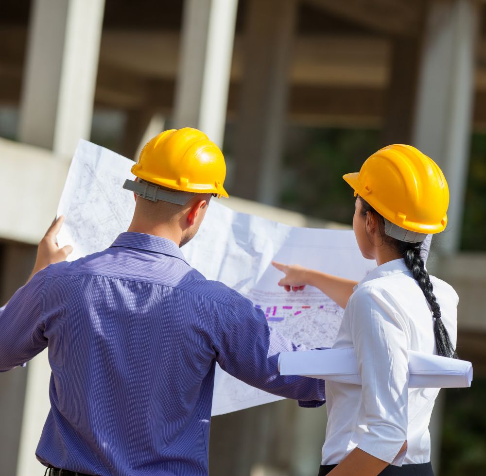 Two project managers looking at plans